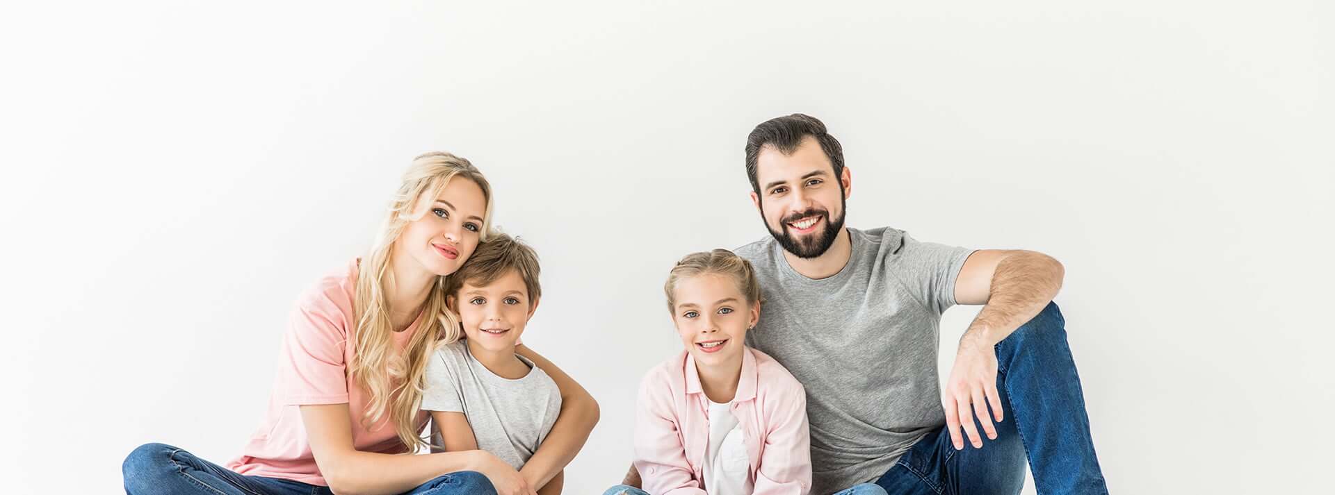 Smiling family on white background
