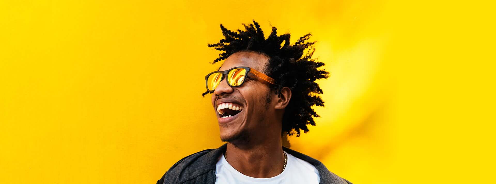 Man with sunglasses laughing
